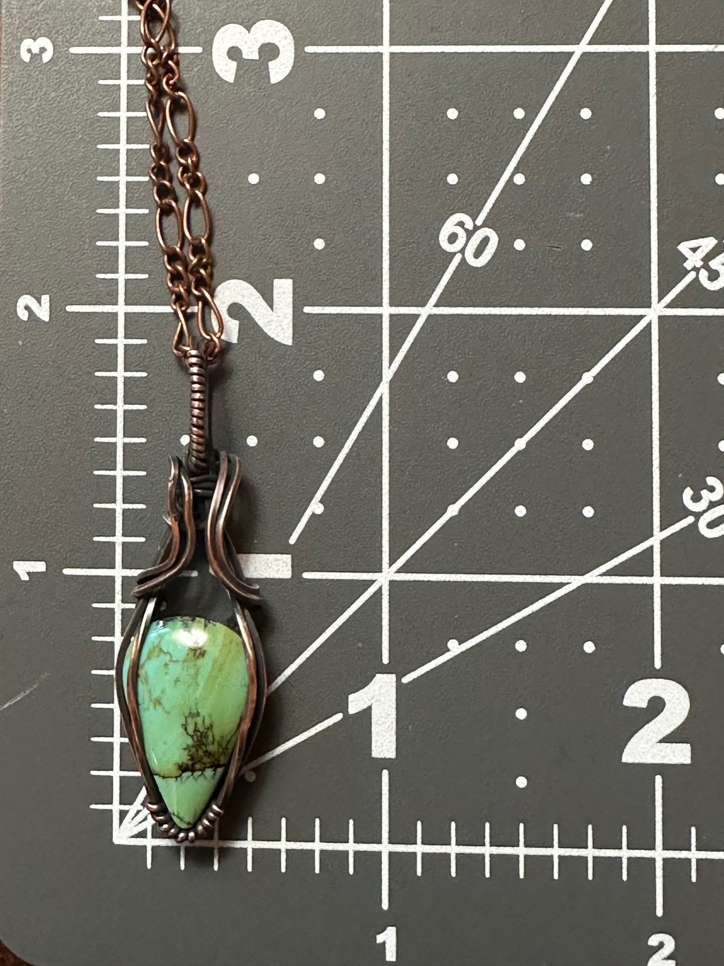 Handmade Turquoise Teardrop Wrapped In Oxidized Copper Wire