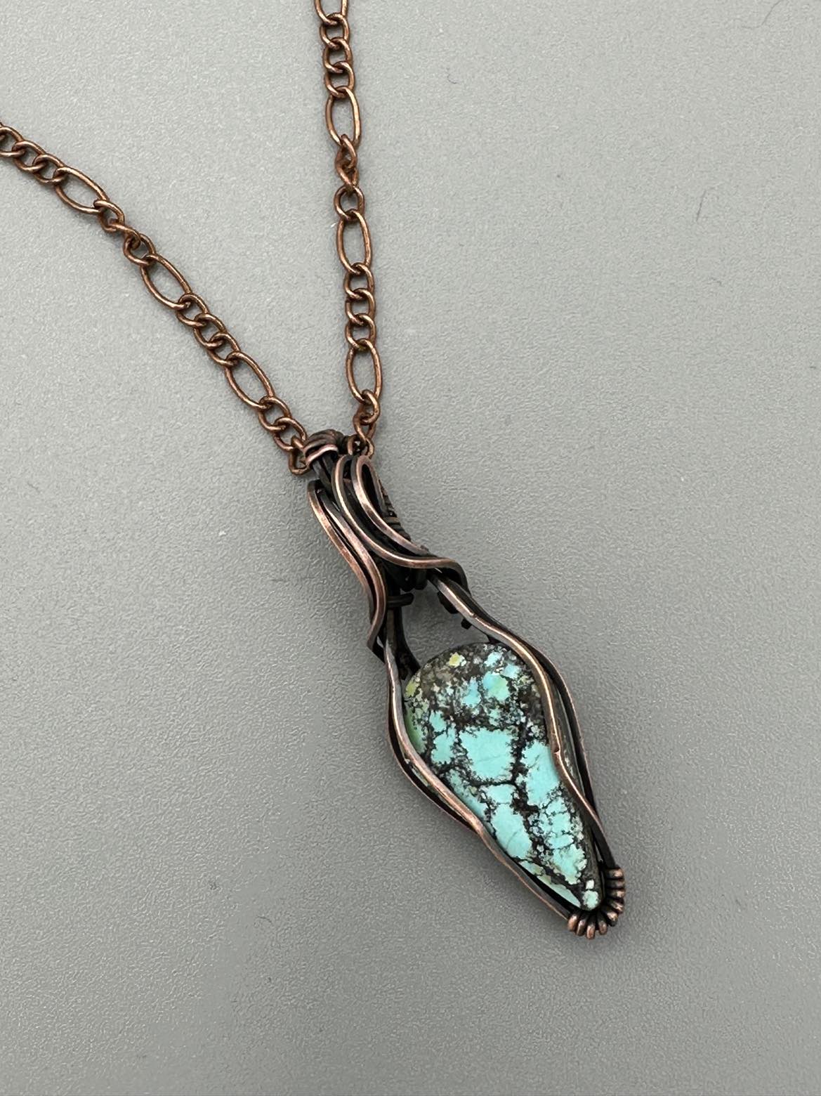 Turquoise Teardrop Pendant Wrapped In Oxidized Copper Wire