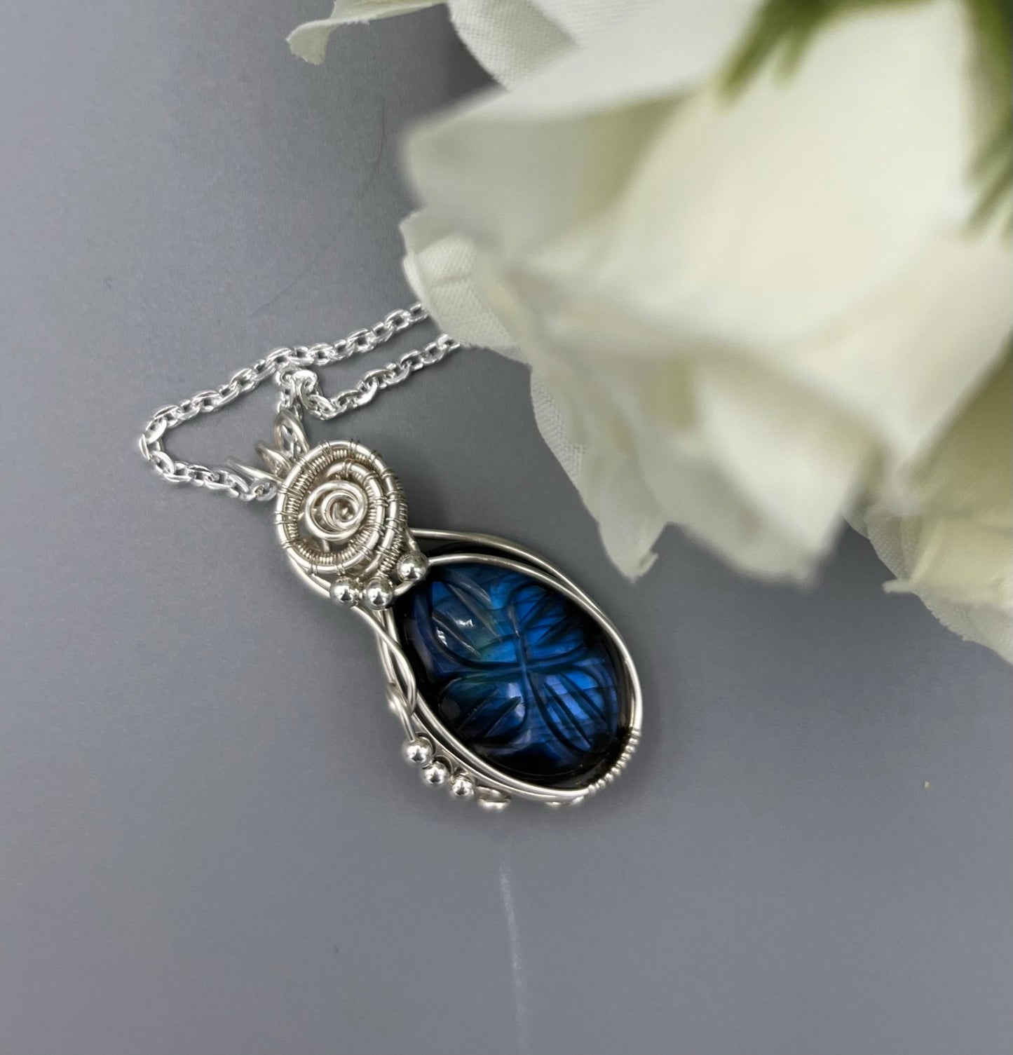 Carved Blue Oval Labradorite Wire Wrapped Pendant in Silver