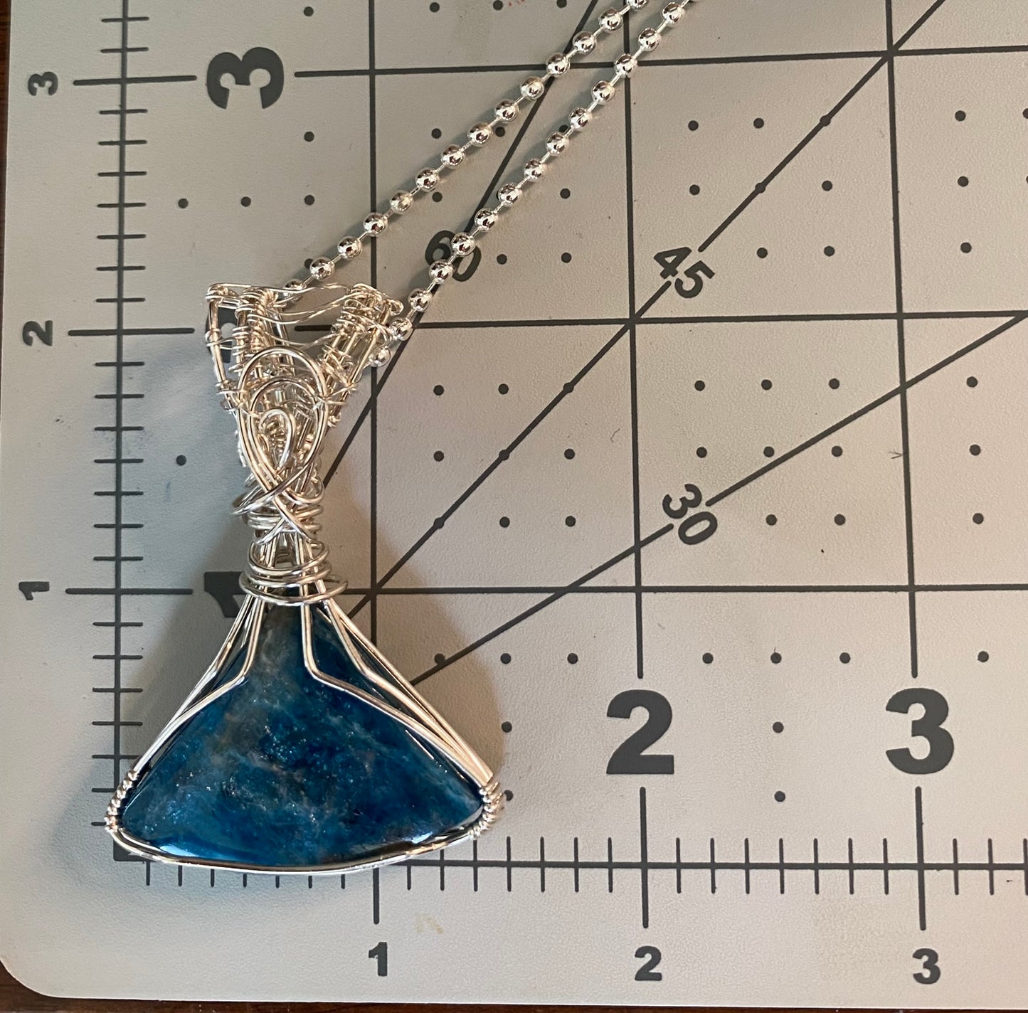 Blue Apatite Wedge Shaped Wire Wrapped Pendant | .935 Sterling Silver