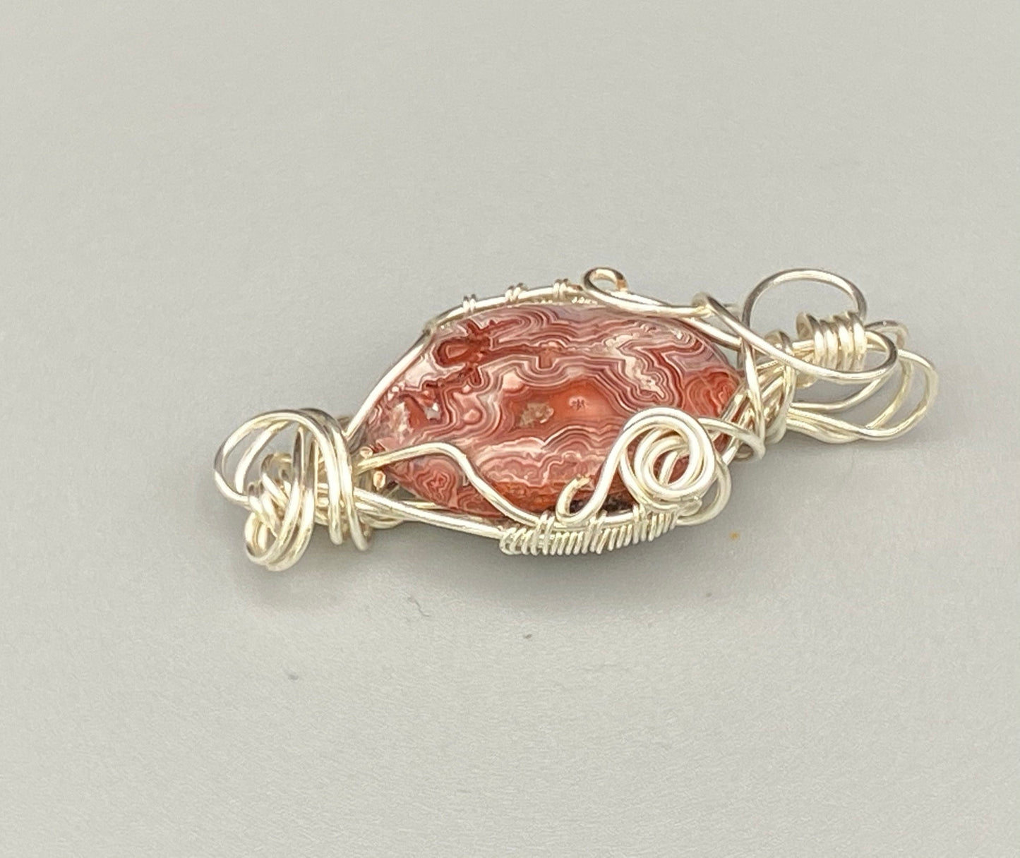 Pink and Red Swirled Wire Wrapped Crazy Lace Oval Pendant