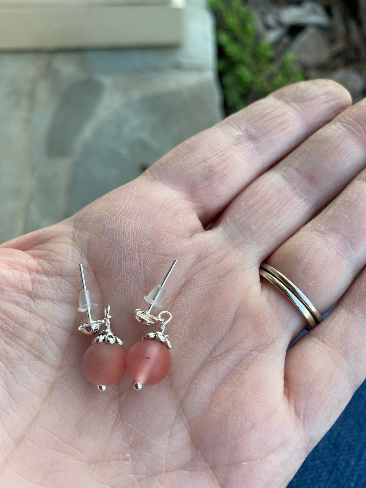 Frosted Pink Beaded Earrings Dangling From A Silver Post