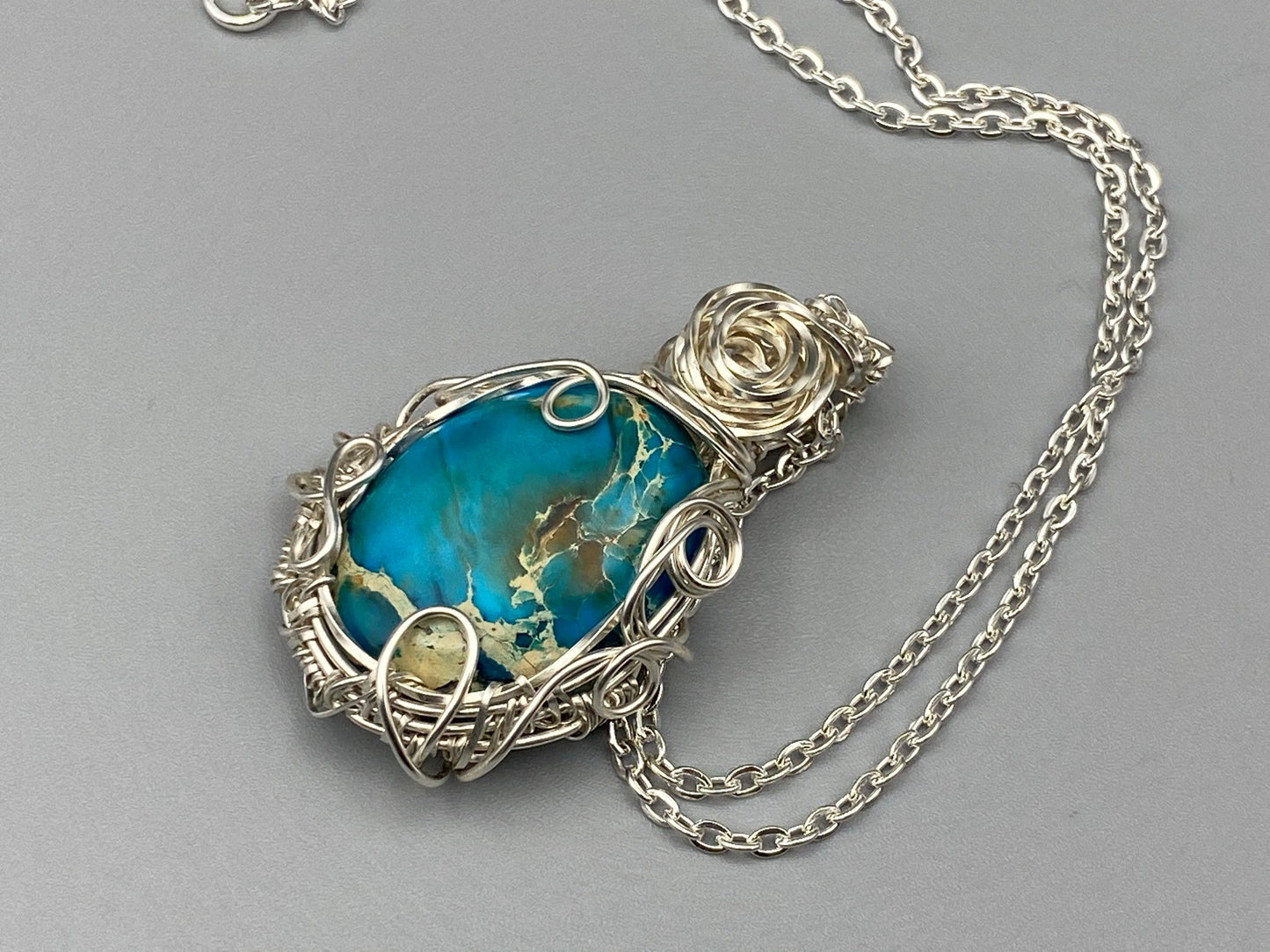 Aqua Oval Wire Wrapped Pendant in Silver Plated Wire
