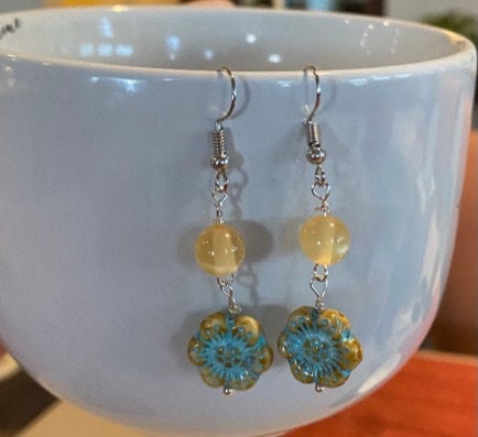 Cute earrings with round beads and blue flowers