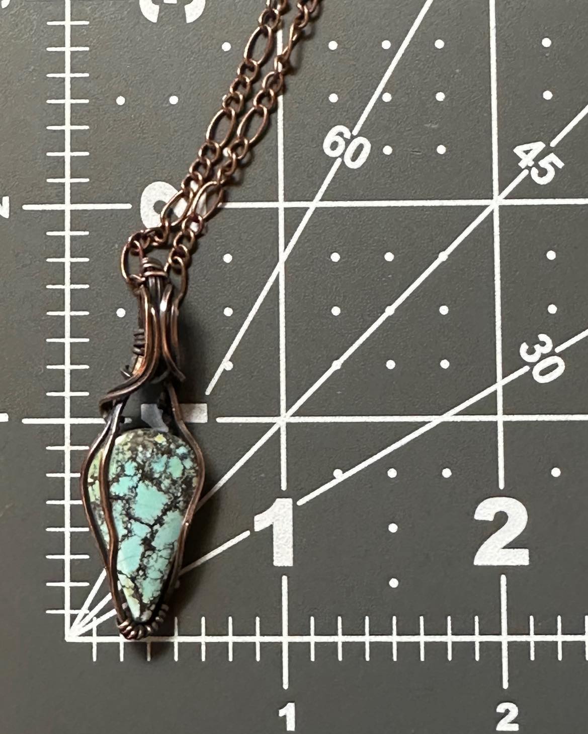 Turquoise Teardrop Pendant Wrapped In Oxidized Copper Wire