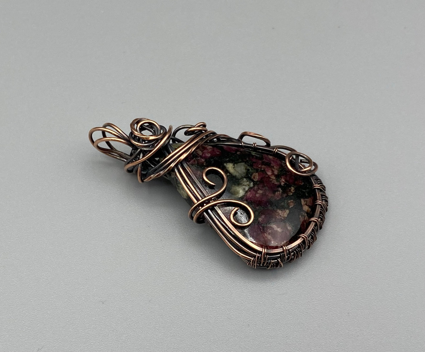 Eudialyte Teardrop Pendant Wrapped in Oxidized Copper Wire
